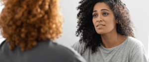 two women having a supportive conversation