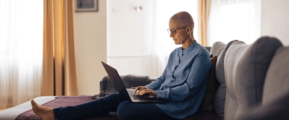 woman with cancer working from home