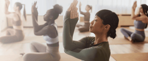 women doing a gentle seated yoga medication class