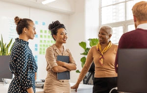 group of 4 people meeting at work