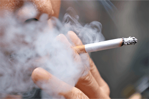 Close up of white male smoking a cigarette