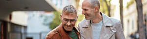 male couple smiling and walking together