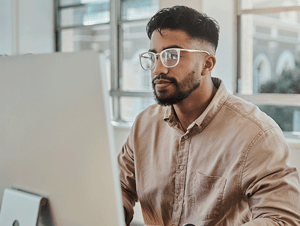 man looking at computer