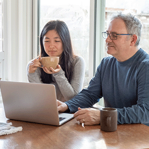 two people searching for cancer information